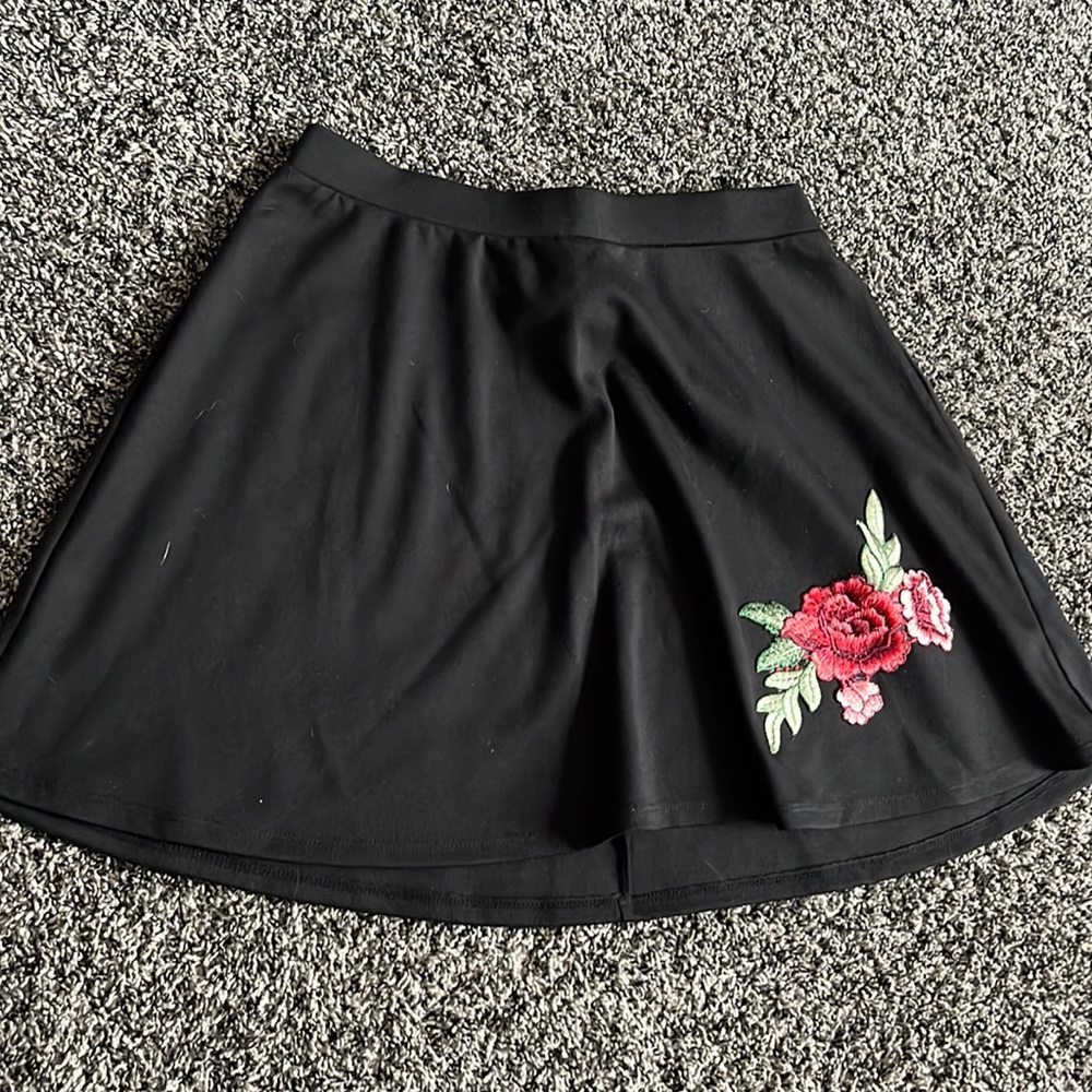 Black skirt with rose